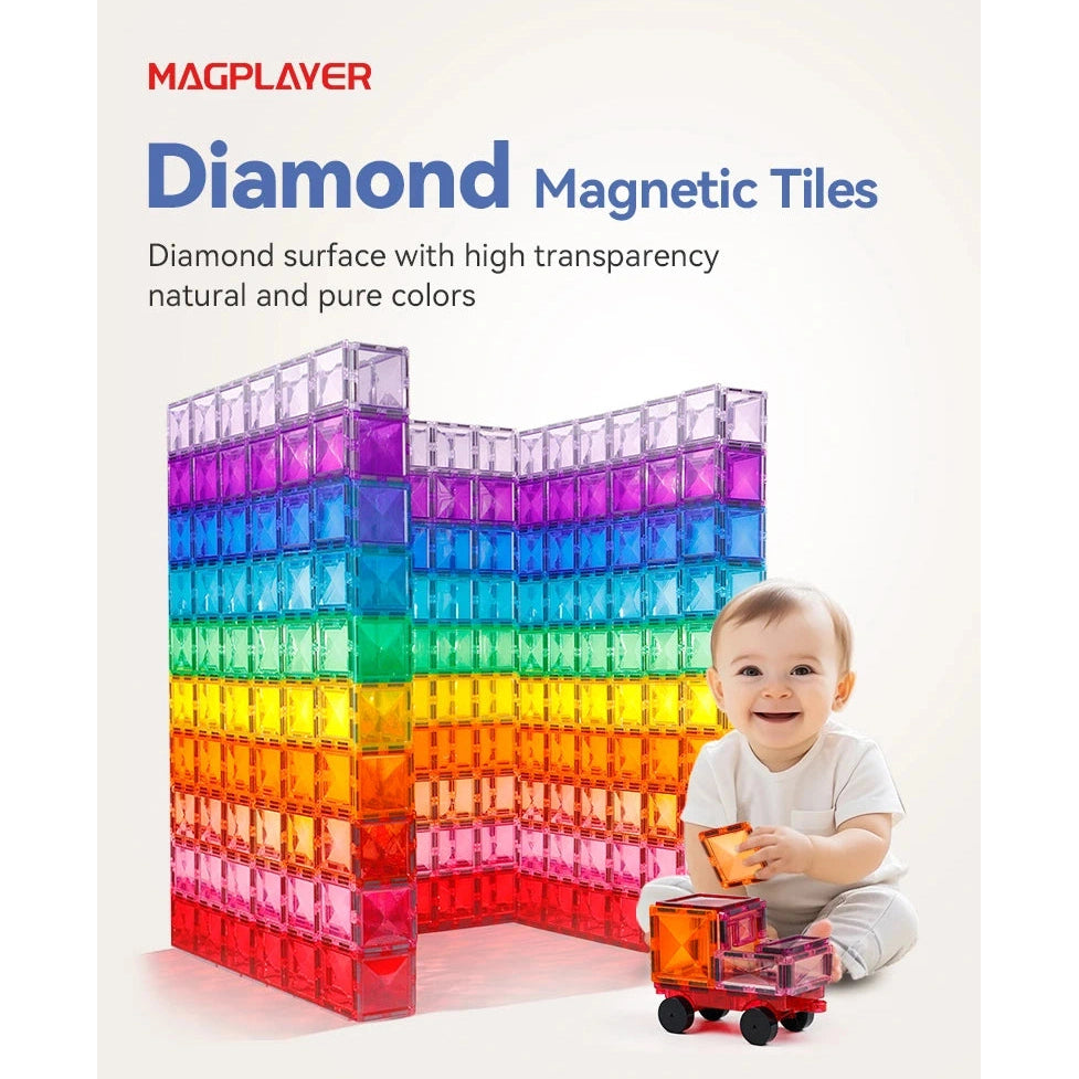 A smiling baby sits on a white surface, holding a toy car. Beside the baby is a vibrant folded construction of translucent, diamond-shaped magnetic tiles in red, orange, yellow, green, blue, and purple. Text reads Montessori Magnetic Building Blocks Set - Creative DIY Construction Tiles for Kids Learning & Play.