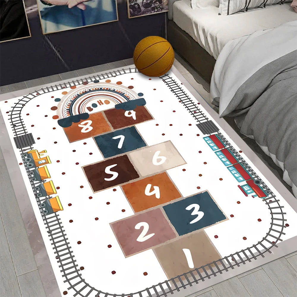 The Hopscotch Printing Carpet in color 5 is a modern, rectangular non-slip rug with a numbered hopscotch grid, toy train track, and playful accents. Place it by the bed for stylish home decoration; its durable and mechanically washable.