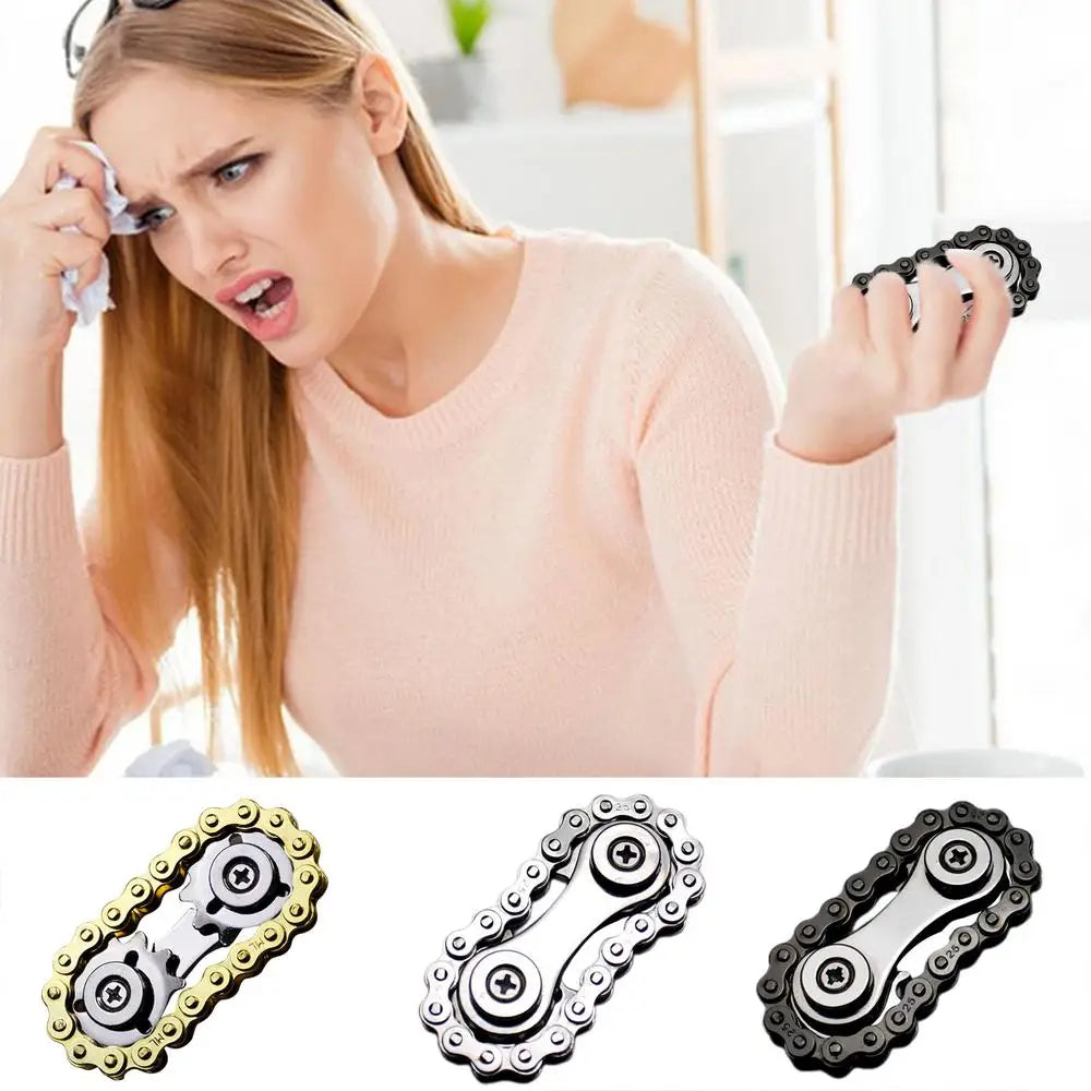 A woman in a pink sweater looks frustrated, wiping her forehead with a cloth. She clutches the Sprockets Flywheel Fingertip Gyro by MezoJaoie—an anxiety-relief fidget spinner made of bike chain metal, available in gold, silver, and black. Ideal for dropshipping enthusiasts seeking unique items.