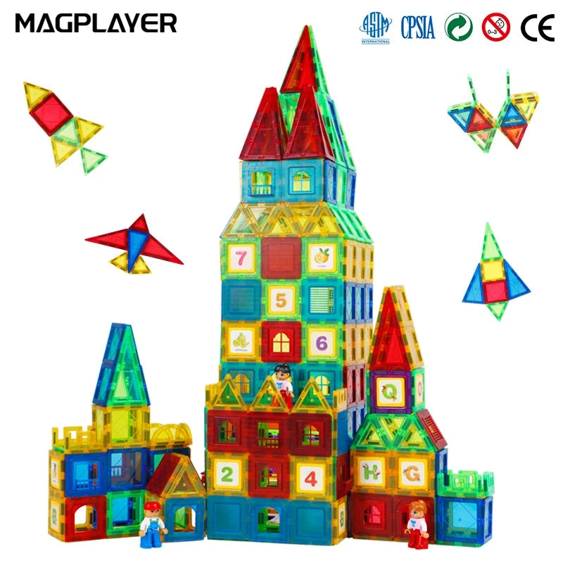 The Magplayer Magnetic Tiles Construction Set for Creative Kids lets you build majestic castles with towers, enhancing cognitive development. Some tiles have numbers and house patterns for educational play, with three human figures nearby and two star-shaped designs floating above.
