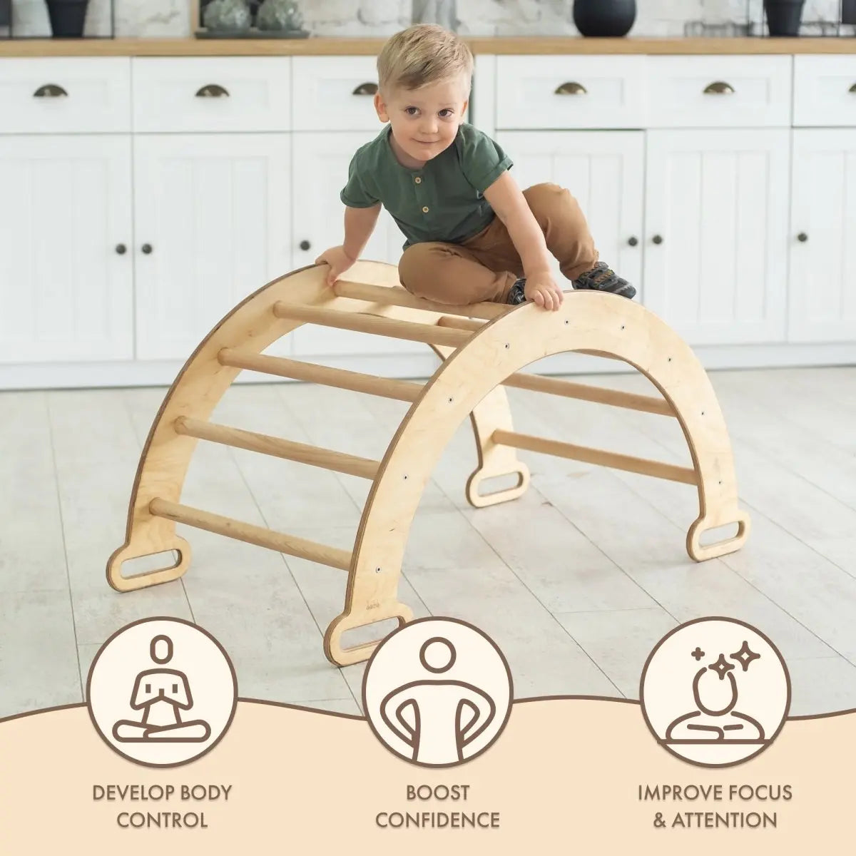 A young child sits on the Climbing Arch & Rocker Balance - Montessori Climbers for Kids 1-7 y.o. – Beige in a bright room. Icons and text below highlight: Develop Body Control, Boost Confidence, and Improve Focus & Attention through play.