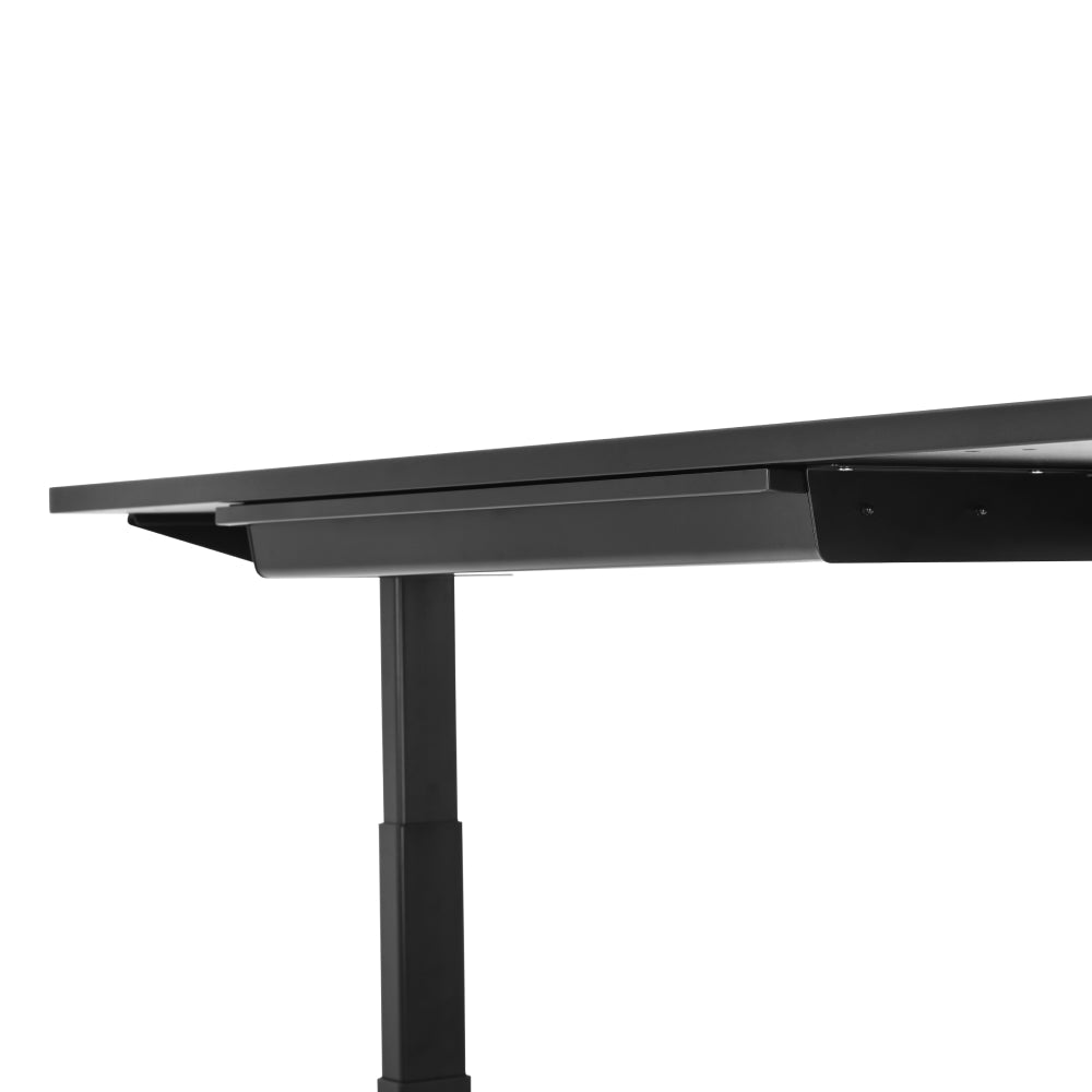 A close-up side view of a black adjustable-height desk featuring the Under Desk Drawer for convenient storage, set against a white background.