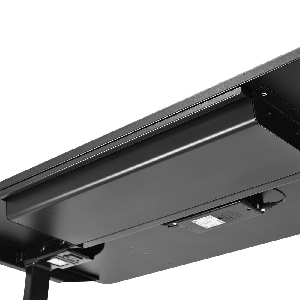 Close-up view of the underside of a black desk, showcasing a rectangular metal cable management tray, an attached control panel, and a sleek Under Desk Drawer for added under desk storage.