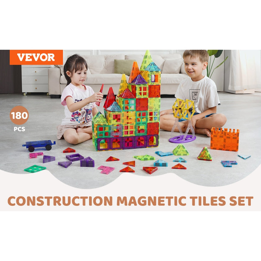 Two kids sit on the floor, building a large castle with the colorful VEVOR 180PCS Magnetic Tile Building Set, an educational construction toy designed to spark creativity and STEM learning.