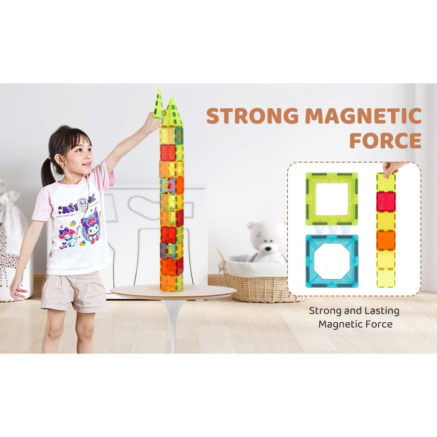 A child constructs a tall tower with the VEVOR 180PCS Magnetic Tile Building Set on a table. The text reads Strong and Lasting Magnetic Force, with two labeled square blocks shown. Toys and a basket in the background foster STEM learning.