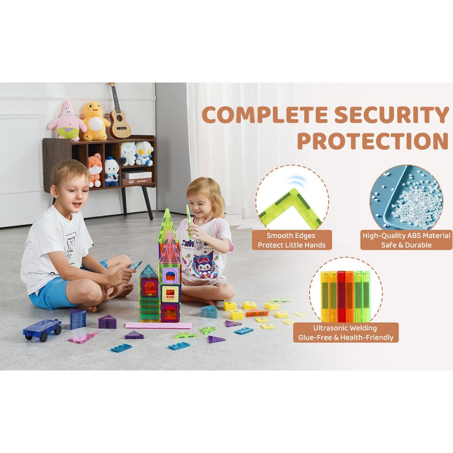 Two children play with VEVOR 121PCS Magnetic Building Blocks Set on a carpeted floor in a cozy room filled with toys and a guitar. The blocks feature smooth edges, high-quality ABS material, and ultrasonic welding for safety and durability.