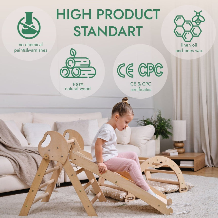 A young girl plays with the 4in1 Montessori Climbing Set—Pikler Triangle, Arch, Slide Board, and Cushion—crafted from 100% natural wood with no chemical paints; finished with linen oil and beeswax. CE & CPC certified.