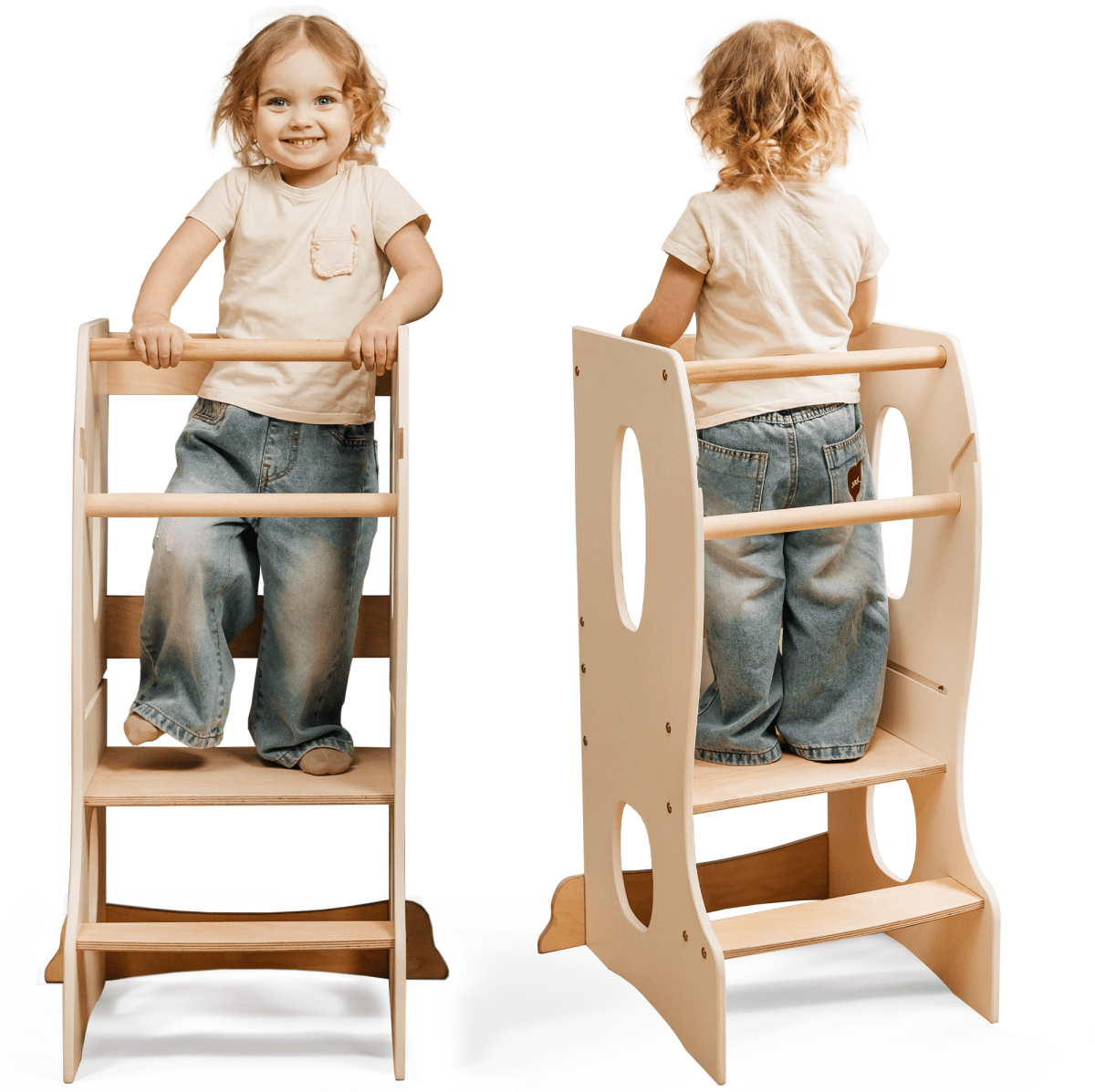 A young child stands on the Stable Montessori Learning Tower: Wooden Growing Chair - Ivory, featuring an adjustable platform, cutout handles, and steps. Shown from front and back, the smiling child wears a beige shirt and blue jeans.