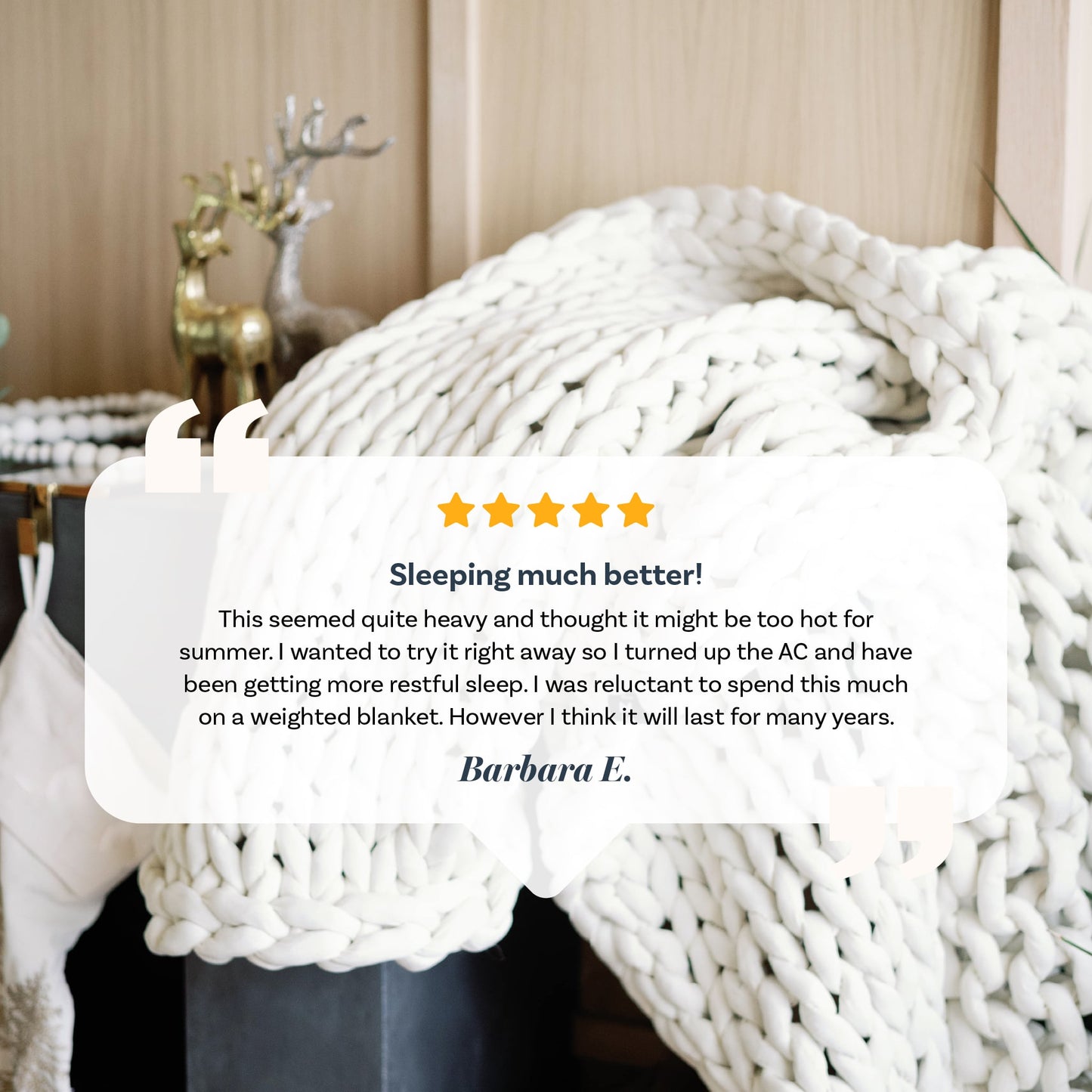 A cream-colored Knit Weighted Blanket is draped over a chair, with a customer review overlay highlighting its quality and comfort for improved sleep.