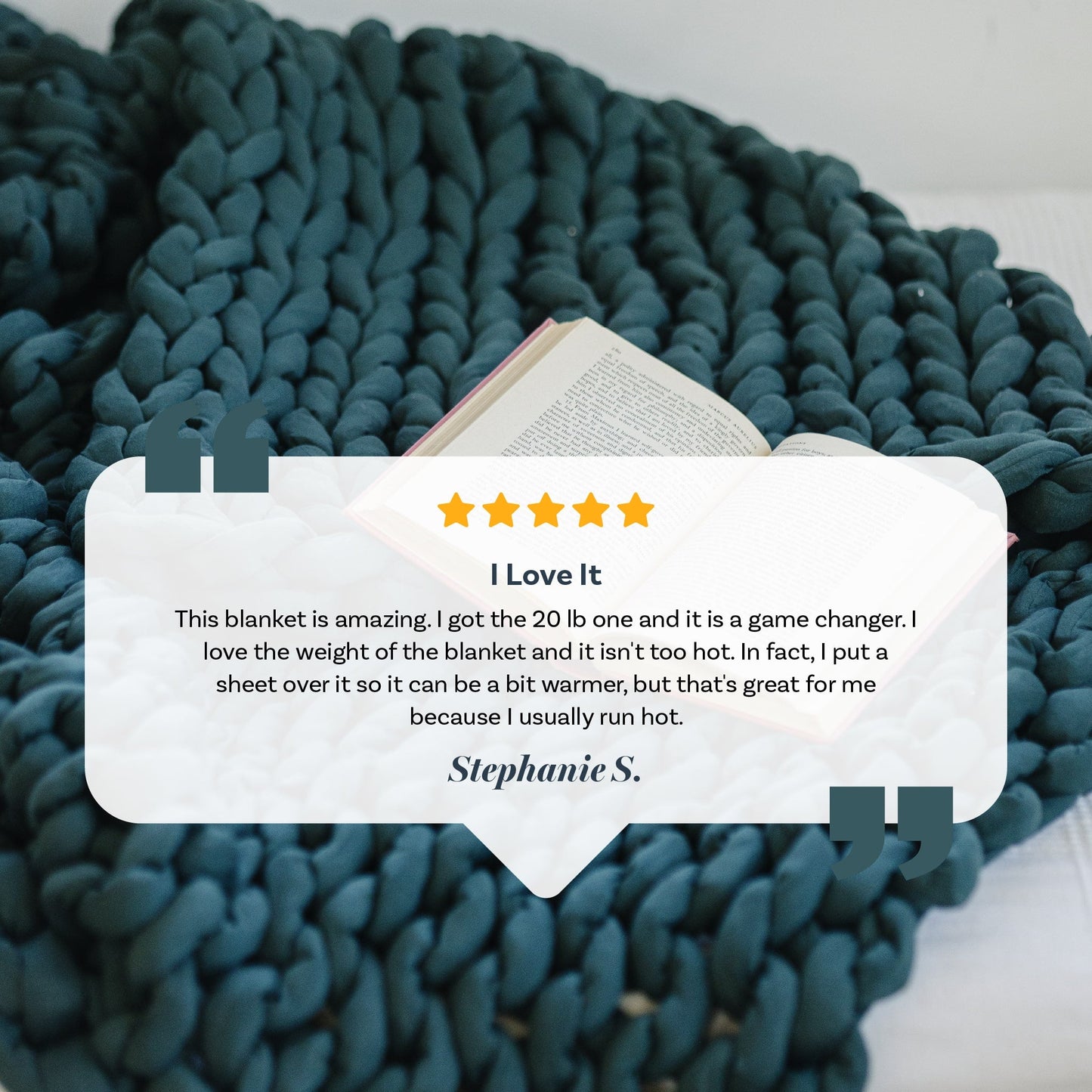 A Knit Weighted Blanket in navy blue is draped on a bed beside an open book. Overlaid is a 5-star review titled I Love It by Stephanie S., praising the blankets weight, comfort, and warmth.