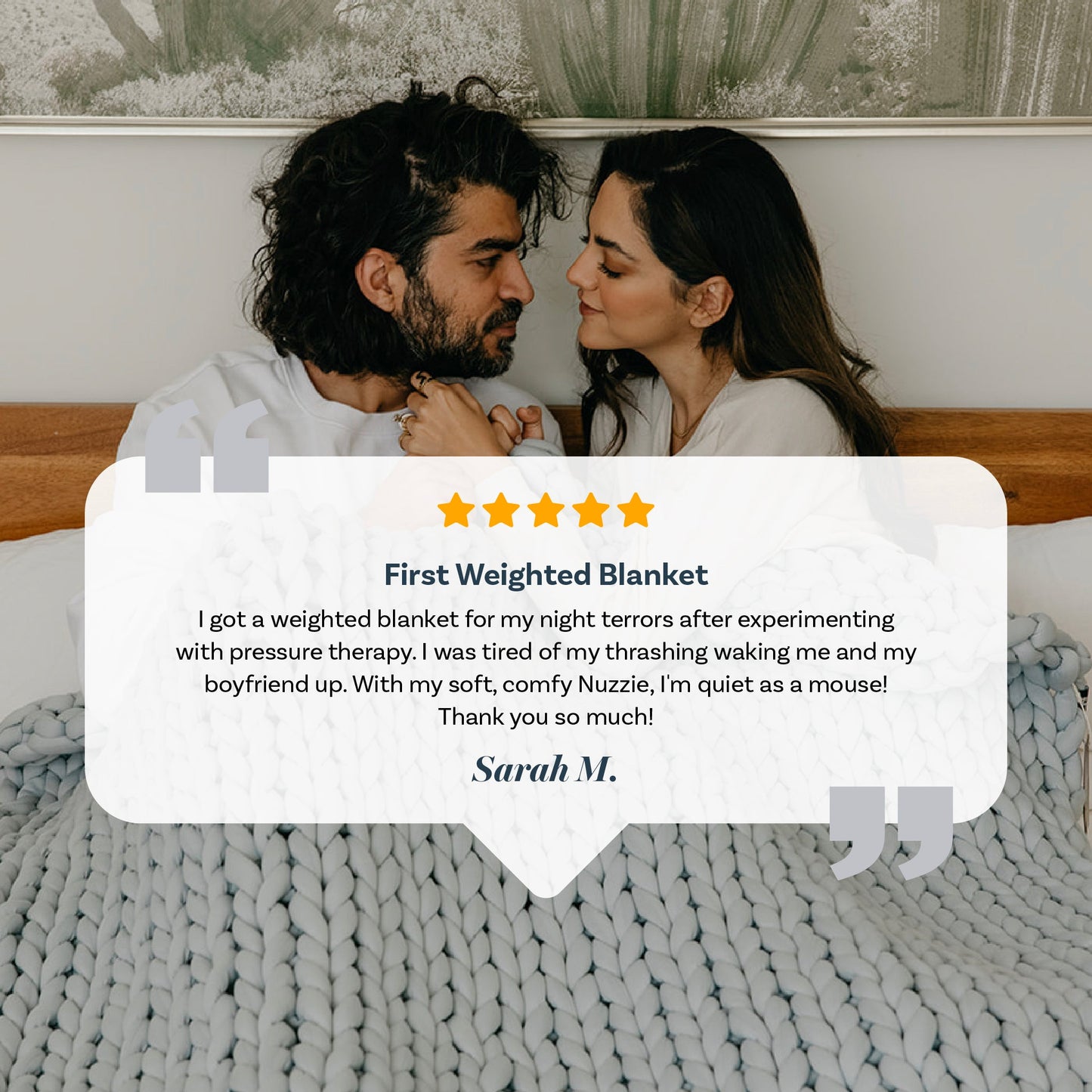 A couple sits together on a bed, cozily wrapped in a Knit Weighted Blanket. Text overlays a 5-star review highlighting the blanket’s soft comfort and its effectiveness at reducing night terrors.