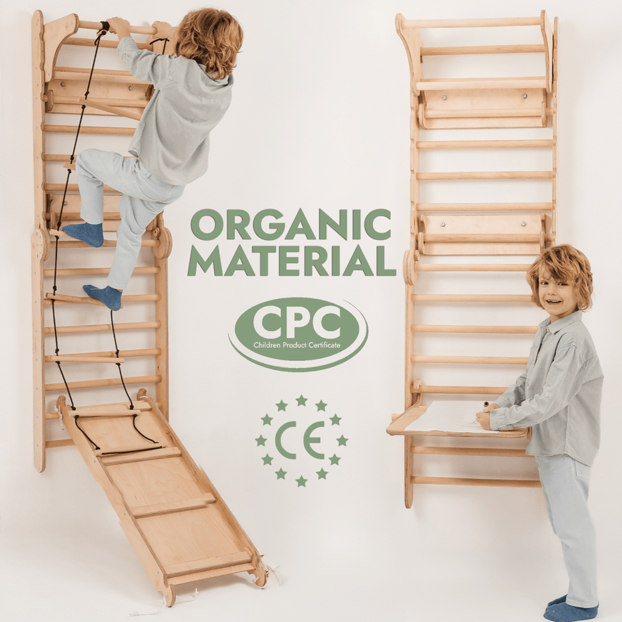 Two young children in light blue pajamas play on the Wooden Swedish Wall Climbing Ladder with Swing Set, Slide Board, and Art Add-on. Text says ORGANIC MATERIAL, CPC, and CE, highlighting safety and certification. Light minimal background.