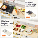 The BistroSwitch 2-in-1 Play Kitchen & Bistro features a reversible stove top and food preparation station with wooden play food, including a pan with shrimp and lemon, sliced vegetables, and a taco for imaginative role-play.