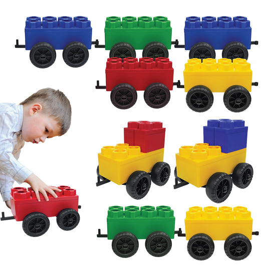 A young boy plays with Jumbo Building Blocks - 10 Car Kits - Bullet Train Set, featuring large red, yellow, green, and blue blocks with black wheels, arranged in rows on a white background.