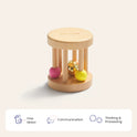 The Tiny Land® Montessori Toys for Newborns (0–3 Months) is a wooden cylindrical toy with vertical rods and vibrant beads inside—ideal for sensory play. It supports fine motor, communication, and cognitive development in babies.