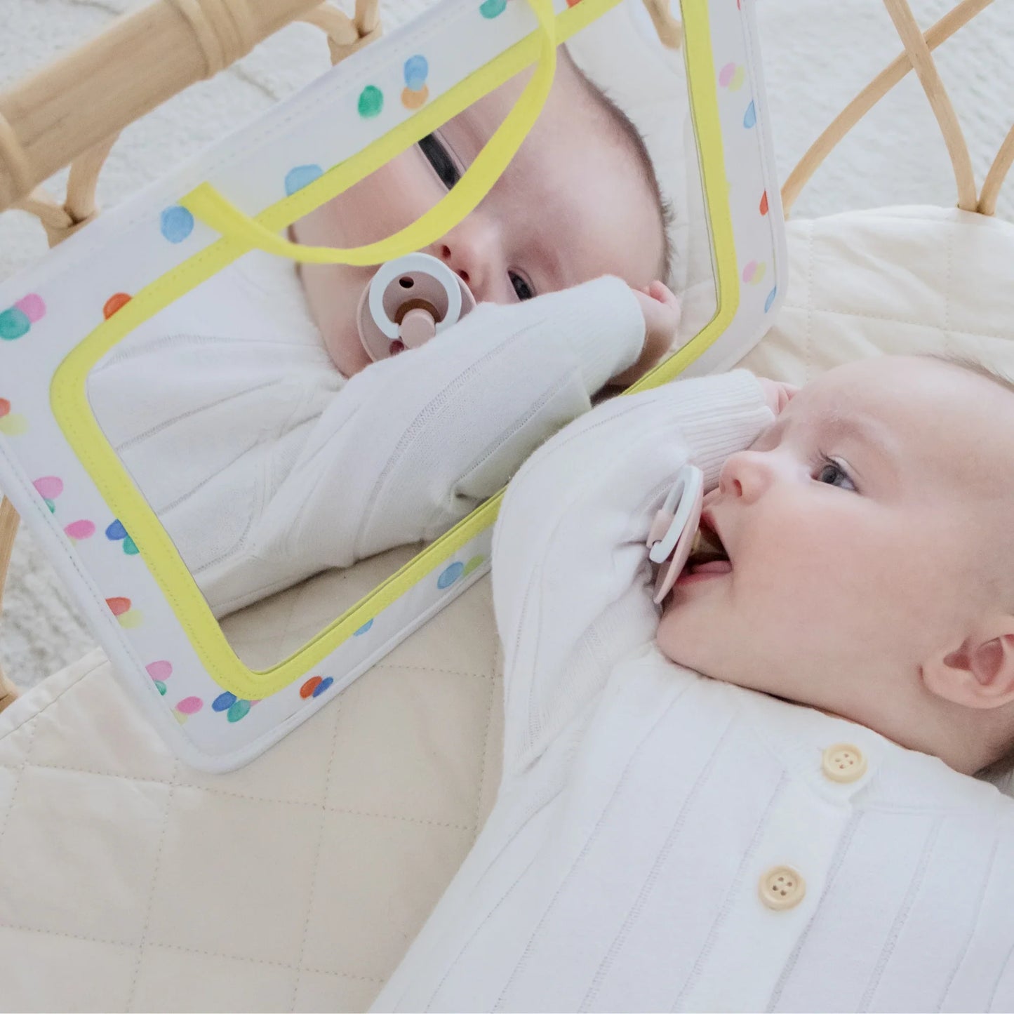 A baby looking in a mirror explores reflections with curiosity—Tiny Land® Montessori Toys for Newborns (0–3 Months) is perfect for tummy time and complements sensory set activities.