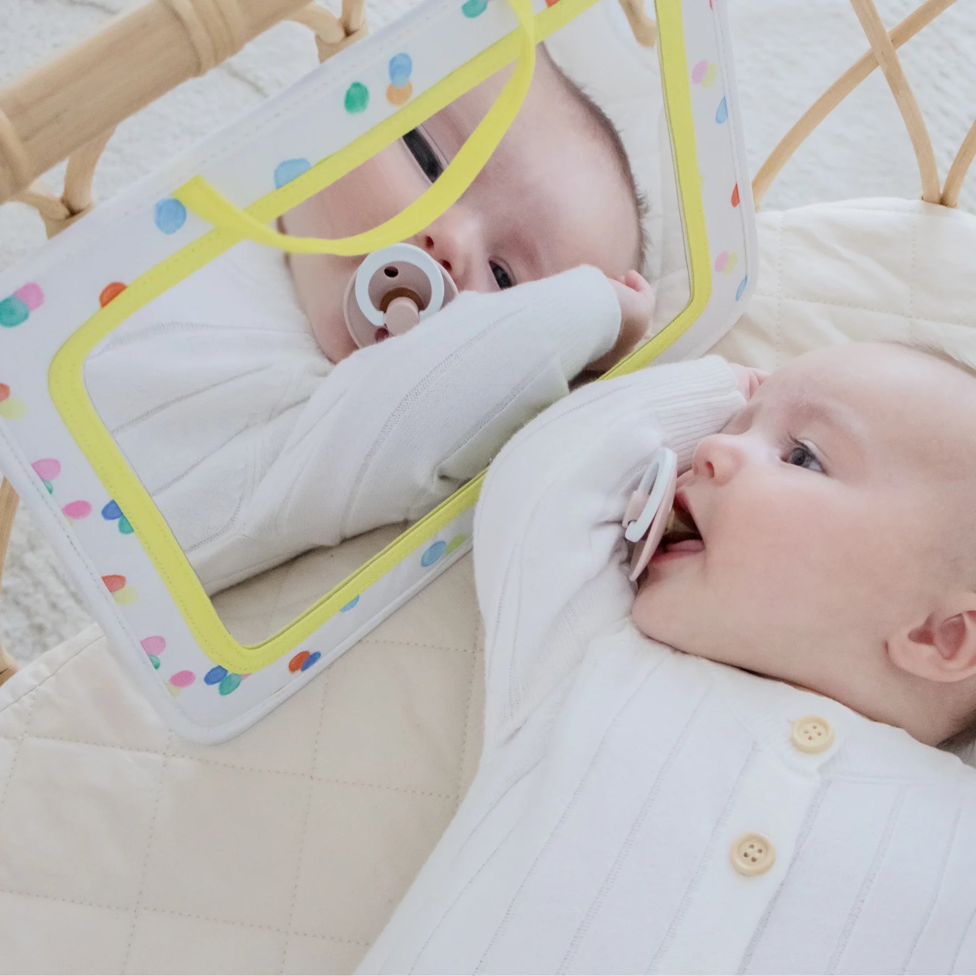 A baby looking in a mirror explores reflections with curiosity—Tiny Land® Montessori Toys for Newborns (0–3 Months) is perfect for tummy time and complements sensory set activities.
