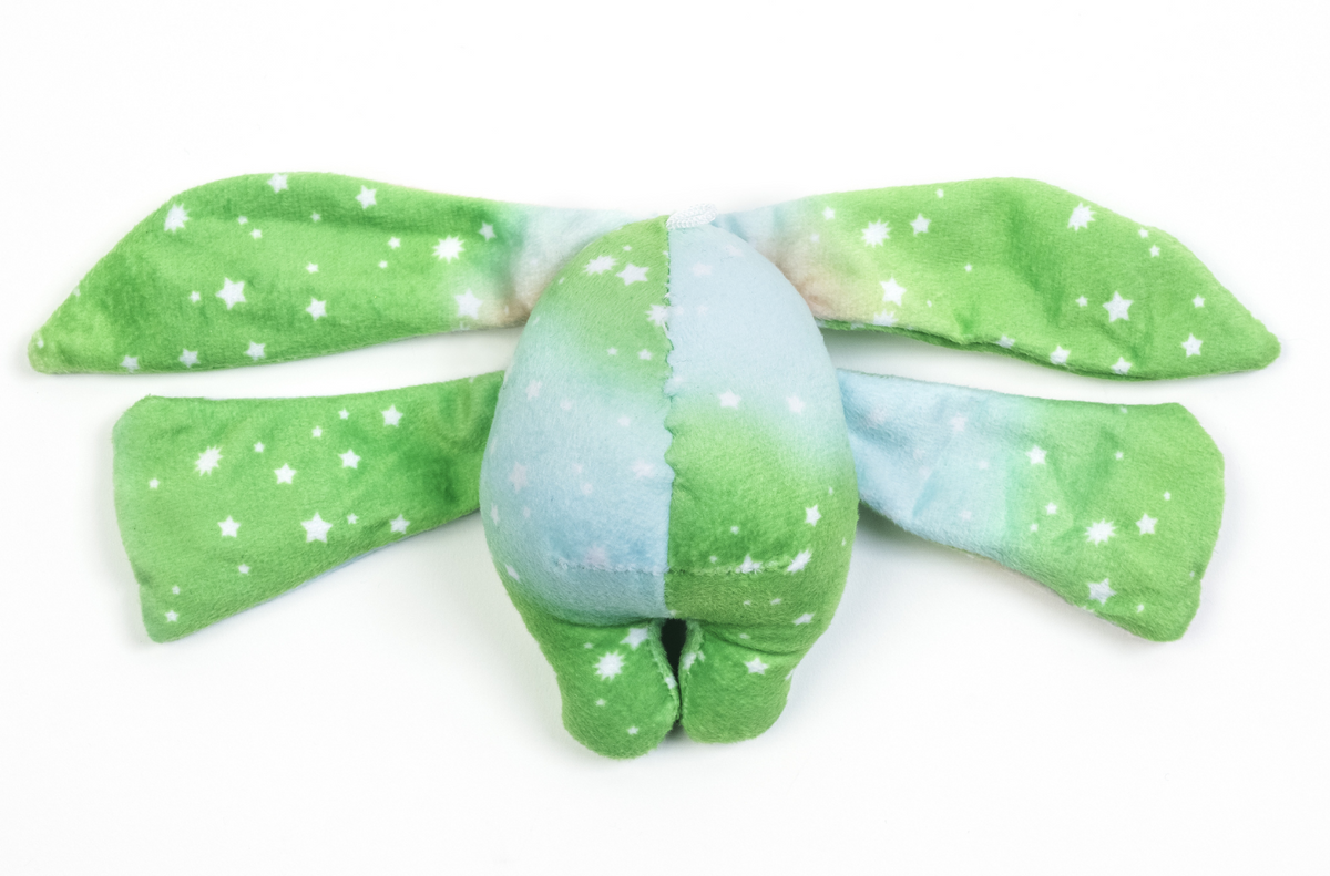 Clover Mini Wrist Hugger – Magnetic Sensory Plush with long, floppy green ears patterned with white stars and a blue-and-green tie-dye body that functions as a magnetic fidget toy.