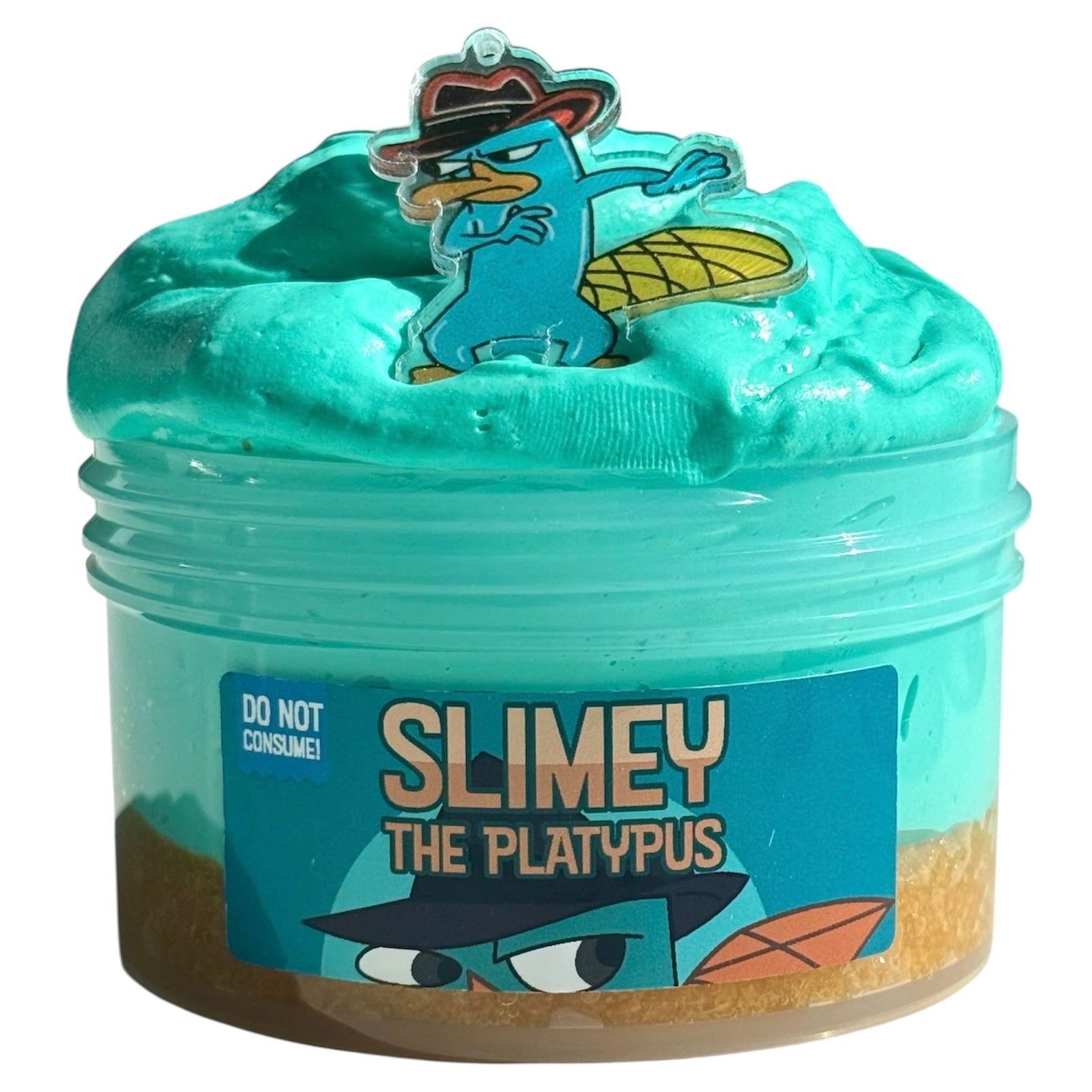 The Slimey the Platypus Teal Butter Slime (7 oz) features a snow fizz add-on, lime frosted cupcake scent, and comes with a Perry sticker. DO NOT CONSUME! Enjoy its fun texture and playful design.