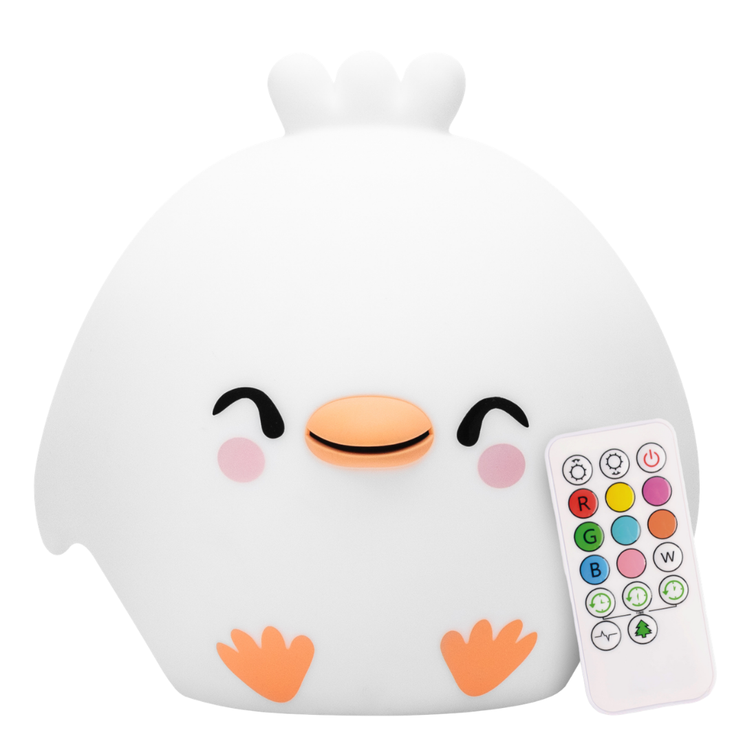 A white Clara the Chicken Silicone Night Light shaped like a chicken with a smiling face, positioned next to a multi-colored remote control for kids.