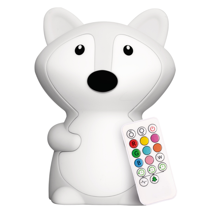 A white Fiona the Fox Silicone Night Light sits next to a multicolored remote control.