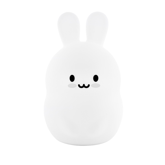 A Basil the Bunny Mini Night Light, designed as a soft silicone white rabbit with a simple, smiling face.