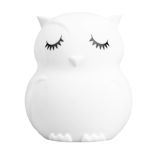 Owen the Owl Mini Night Light in the shape of a rechargeable white owl with closed eyes and long eyelashes.