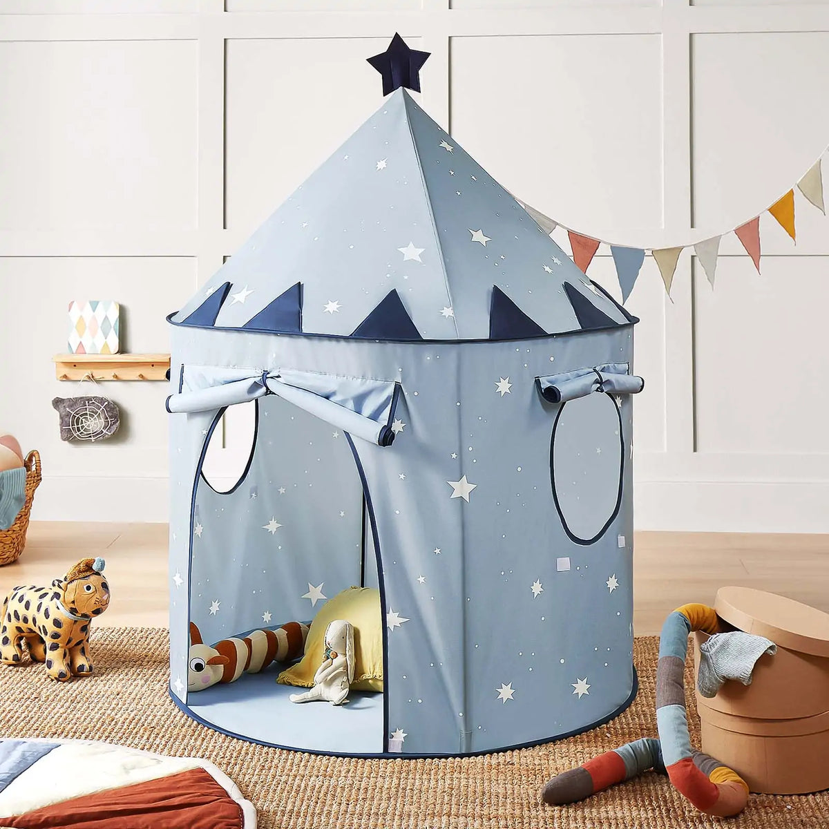 Starry Indoor Play Tent for Toddlers in blue, featuring a conical shape with white stars, a star-shaped topper, and roll-up windows to create a cozy kids clubhouse.