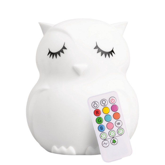Opal the Owl Silicone Night Light in the shape of a white owl with closed eyes, including an accompanying remote control.