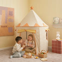 Two children play with a wooden tea set inside a Starry Indoor Play Tent for Toddlers, which is a checkered clubhouse topped with a star.