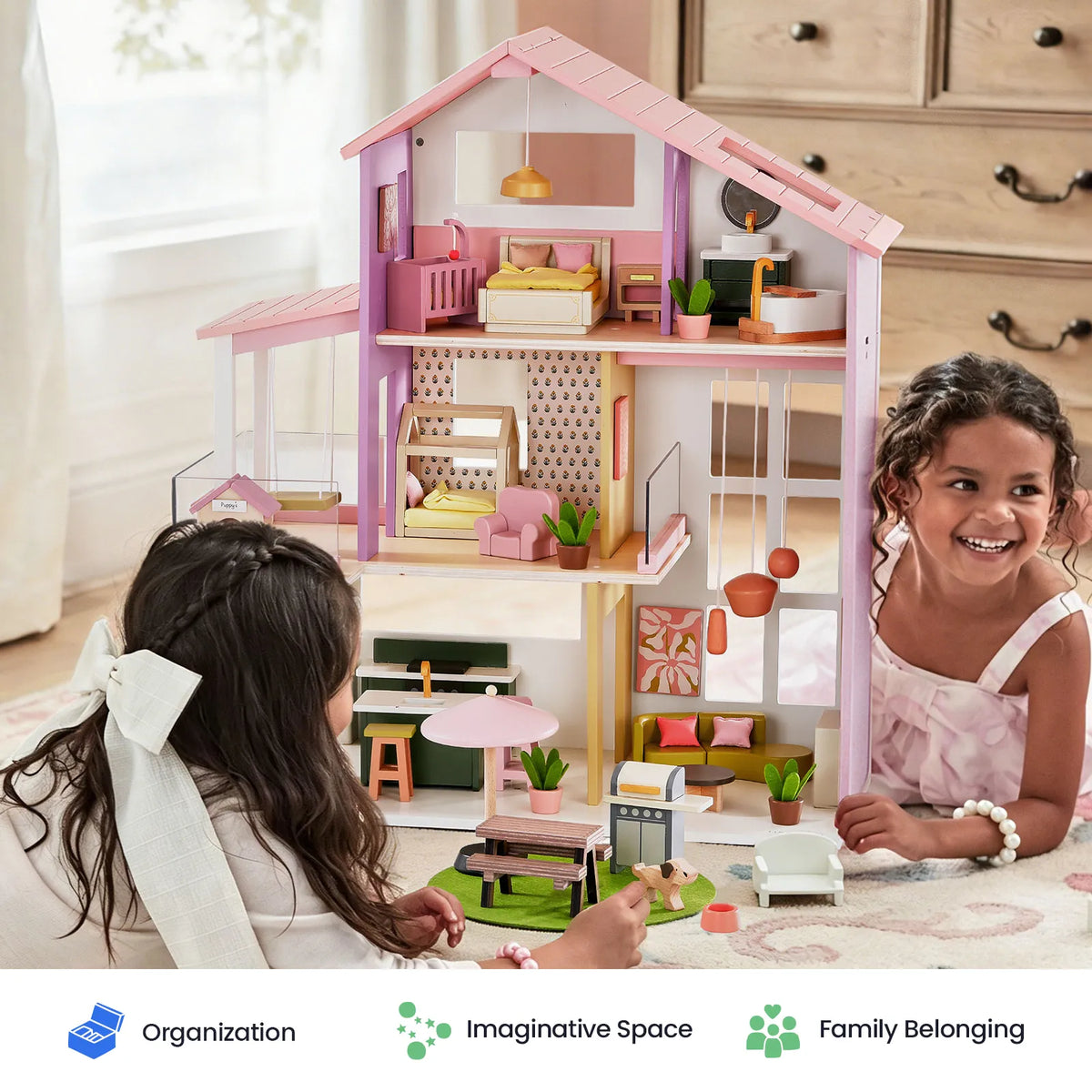 Two children playing with a 1:12 scale wooden Sweetwood Cottage Dollhouse filled with 48-pc furniture.