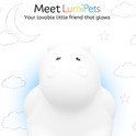 Honey the Hippo Silicone Night Light glows white against a background of cartoon clouds, stars, and a crescent moon.