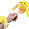 A hand wears a yellow, orange, and white Spark Mini Wrist Hugger – Magnetic Sensory Plush with long ears, while a matching second plush hangs nearby.