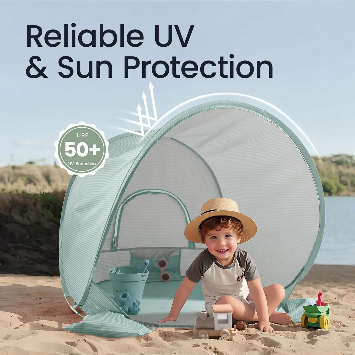 A toddler wearing a sun hat sits inside a Kids Beach Tent & Sand Toy Set with a bucket, toy train, and truck; text reads Reliable UV & Sun Protection with a UPF 50+ badge on the UV-protective fabric.
