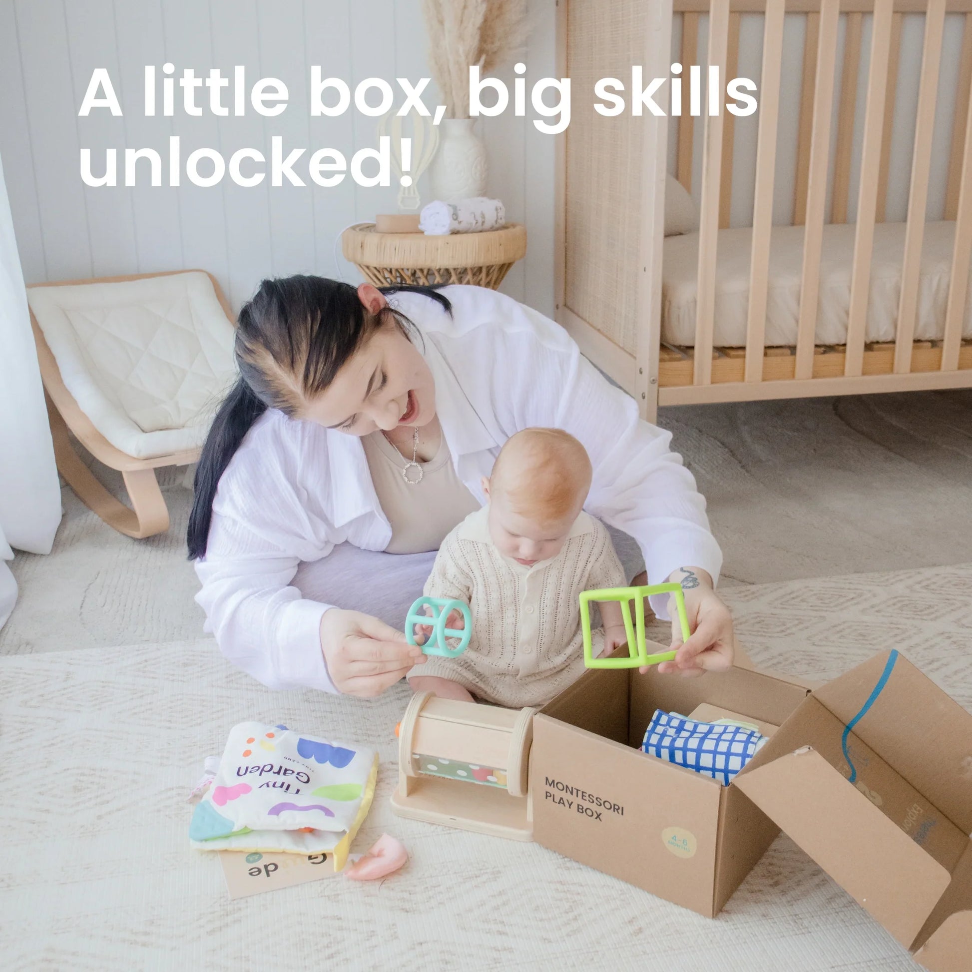 A woman and her baby play on the floor with Tiny Land® Montessori Toys for Newborns (4–6 Months) from an open box. Text reads, “A little box, big skills unlocked!” A cozy room features a crib and a chair in the background.