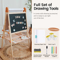 The Tiny Land® Magnitales Easel for Kids stands on a round rug and features a chalkboard, magnetic letters, height adjustment, a paper roll, three paint cups, eraser, whiteboard marker, and four dust-free chalks for creative play.