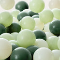 A pile of Ball Pit Balls (200 pc) – Soft Mixed Tones in sage green, dark forest green, and off-white.