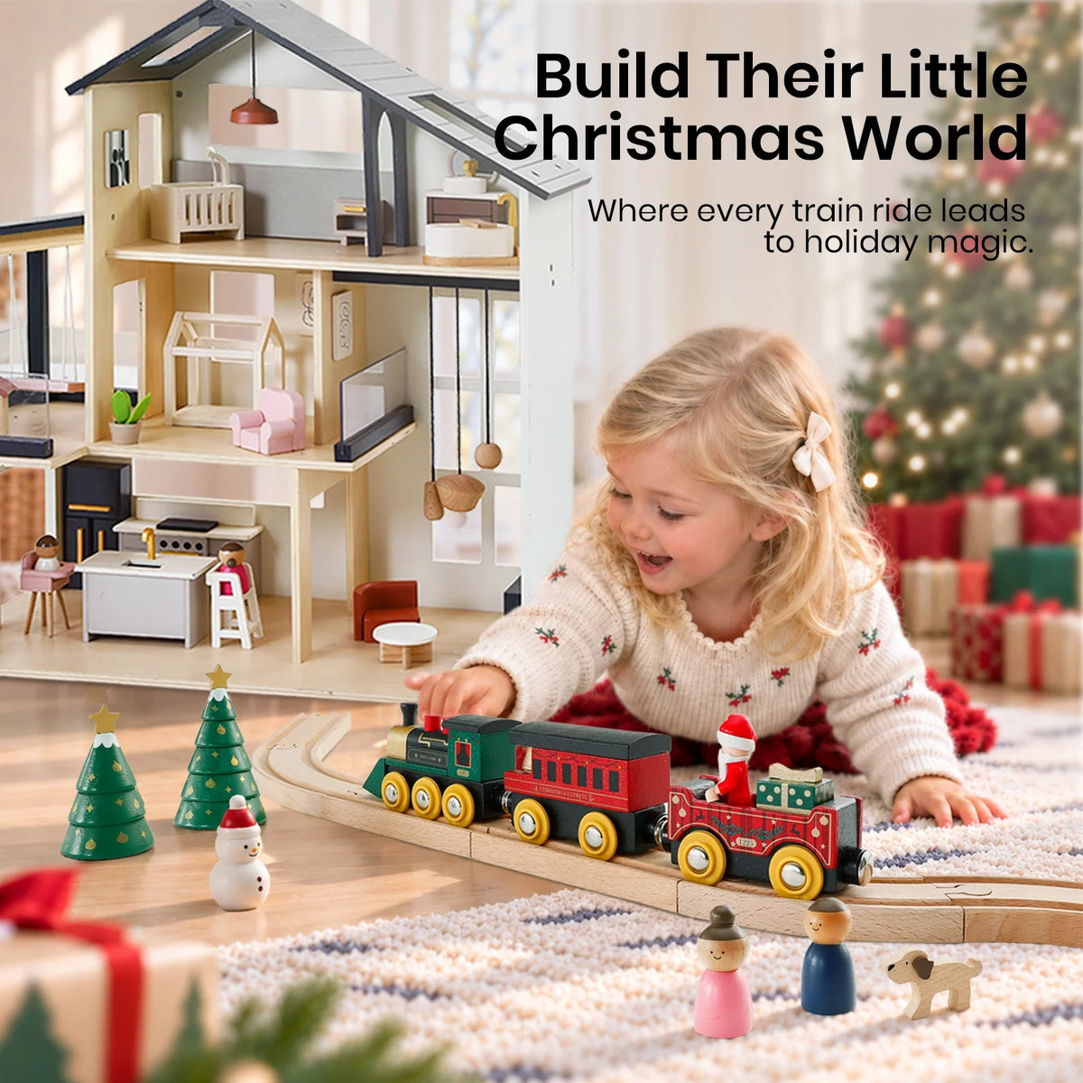 A young girl plays on the floor with a Christmas Express Wooden Train Set and dollhouse in front of a decorated Christmas tree.