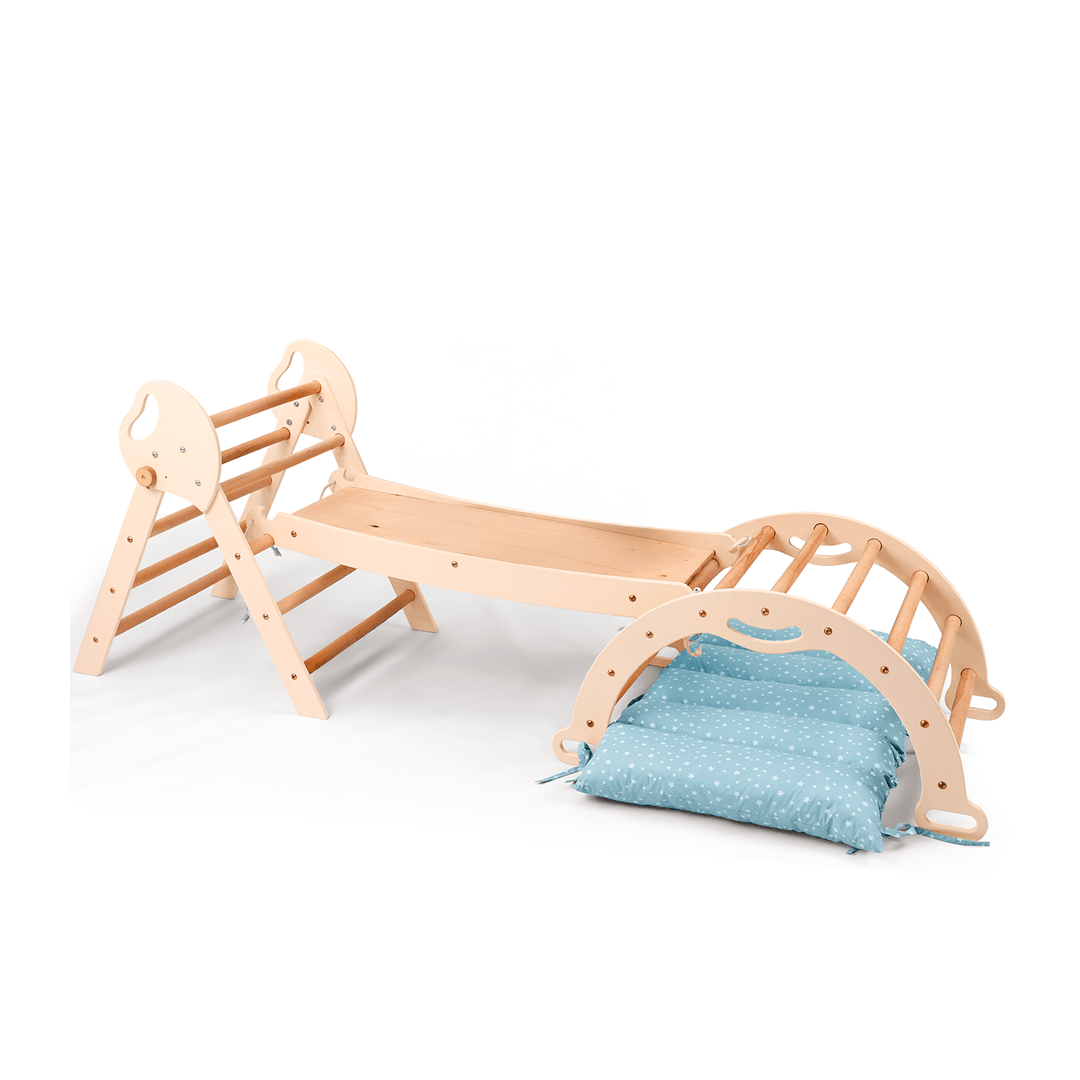 The 4in1 Montessori Climbing Set for toddlers (1–3 years) in ivory includes a Pikler triangle, arch, slide board, and cushion, shown with the cushion under the arch on a white background.