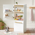A white toy refrigerator with its door open, stocked with a Pretend Meat & Seafood Play Pack, including wooden vegetables, canned goods, and miniature cartons for kitchen play.
