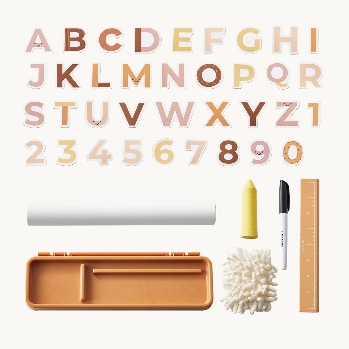 Accessories for the 3-in-1 Adjustable Tabletop Art Easel, including alphabet and number magnets, a roll of paper, a yellow crayon, a black marker, a white fuzzy eraser, and an eight-inch ruler.