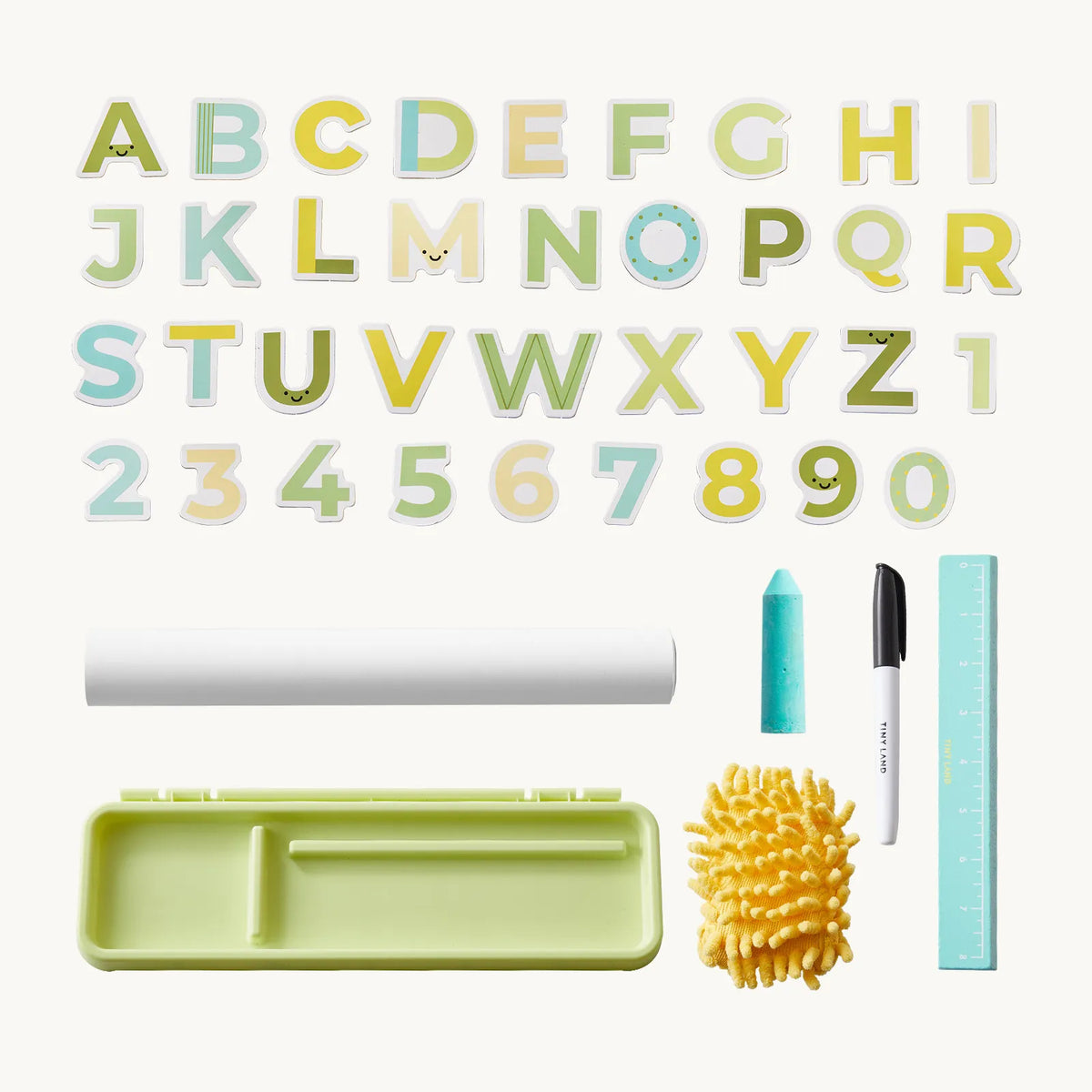 3-in-1 Adjustable Tabletop Art Easel featuring alphabet letters, numbers, a roll of paper, chalk, a black marker, a ruler, a yellow duster, and a divided plastic storage tray.