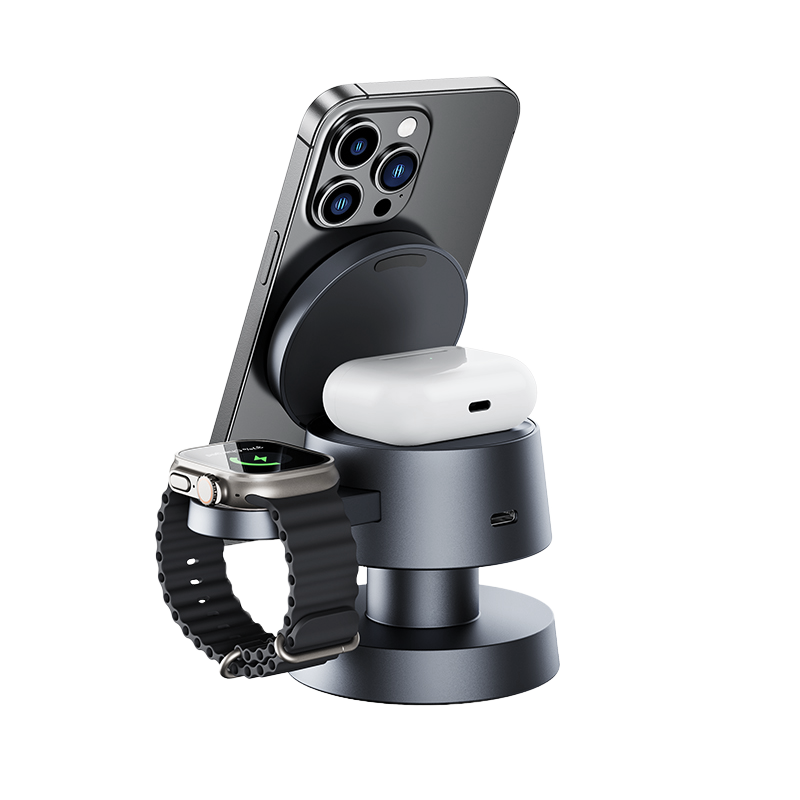 The 4-in-1 Wireless Charging Station features a sleek metallic design and simultaneously charges a smartphone, wireless earbuds in a charging case, and a smartwatch with a black band—ideal for Apple devices, shown on a plain white background.