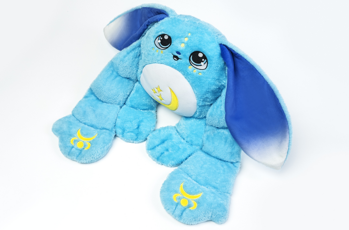 Bo the Moon Pal – 5 lb Weighted Plush is a light blue jumbo weighted bunny with long, dark-tipped ears, large eyes, and yellow crescent moon icons on its chest and paws.