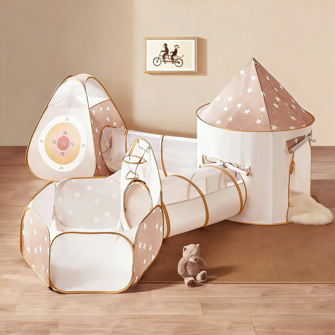 The Tiny Land® Discovery 5-in-1 Play Tunnel With no Balls, featuring a star-patterned playhouse, tunnel, and target area, is set up on a wooden floor with a nearby teddy bear and a picture of two people riding a bike on the wall.