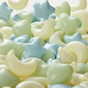Fun-Shapes Ball Pit Balls (200 pc) featuring a collection of pastel-colored stars, moons, and hearts for sensory exploration.