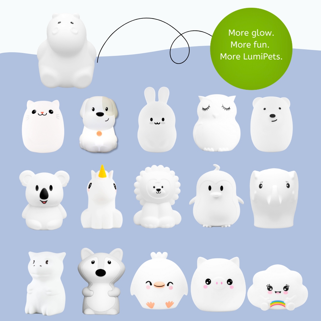 A grid of fifteen white silicone animal-shaped night lights, including Honey the Hippo, cat, dog, rabbit, owl, bear, koala, unicorn, lion, penguin, elephant, fox, chick, pig, and a rainbow cloud acting as a soothing light for kids.