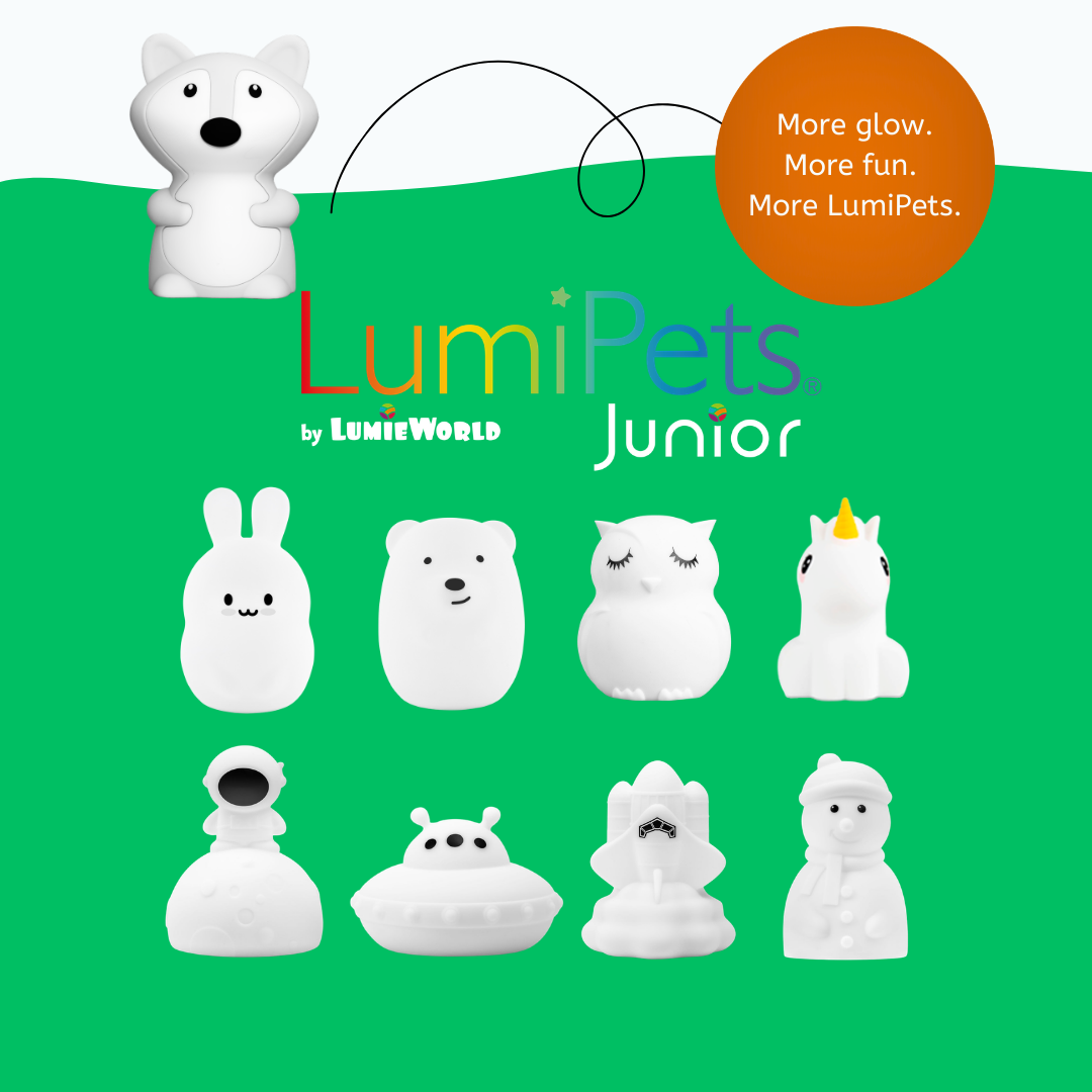 A collection of nine rechargeable white silicone night lights, including a Felix the Fox Mini Night Light, plus a rabbit, bear, owl, unicorn, astronaut, UFO, space shuttle, and snowman, arranged on a green background.