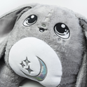 Gamma the Moon Pal – 5 lb Weighted Plush is a jumbo grey rabbit with large, embroidered eyes and a white belly patch featuring an embroidered crescent moon and stars, serving as a calming hug pillow.
