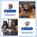 Two children play an educational board game from the Grades 1–2 Readiness Backpack at a desk, surrounded by icons and text highlighting teacher-approved, parent-loved tools for building math skills and at-home learning.